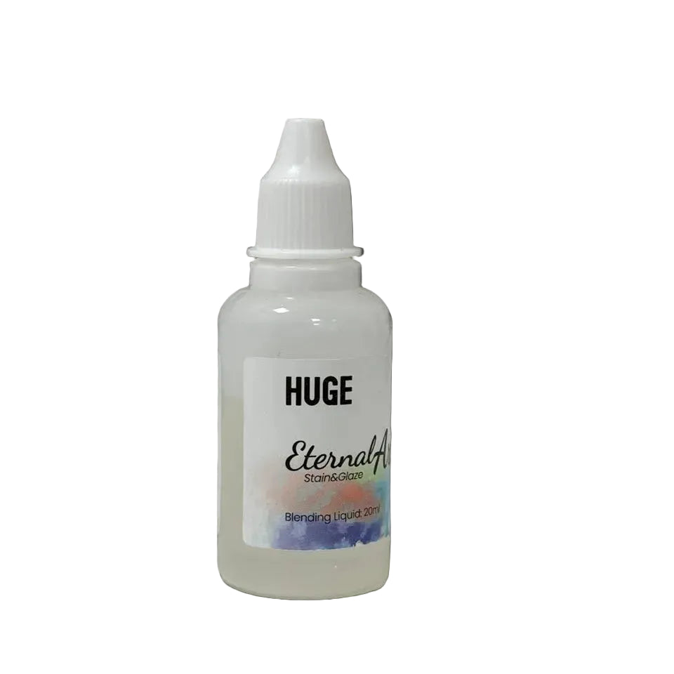 Small bottle labeled 'HUGE Eternal' on a white surface with a blurred background